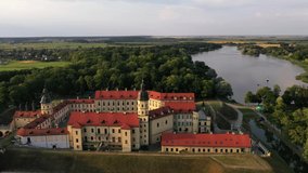 Flying over the Nesvizh castle, the Park around the castle and the lake, aerial video of Nesvizh