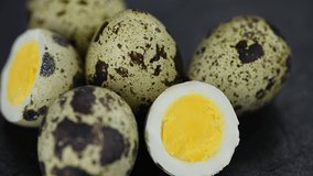 Cooked Quail Eggs rotating on a plate 