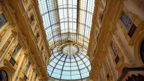 Milan, Italy, April 12, 2020: Vittorio Emanuele Gallery is empty of people and a tourist. Piazza Duomo. The quarantine from Covid19 in Italy. Quarantine in Milan. Closed luxury shops, bar, restaurants