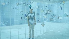 Animation of Caucasian woman wearing vr headset over social icons floating. Social distancing self isolation working from home during quarantine lockdown concept digitally generated - Powered by Shutterstock - Get 15% off with code: PIKWIZARD15