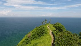 Smooth drone footage of Nipah Hill, Lombok, Indonesia. The combination of the hill and the sea just perfect with the forward video movement