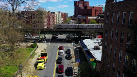 Bronx, NY/United States - April 22, 2020: This is an aerial view of a subway train passing on a bridge in the Bronx, New York.   
