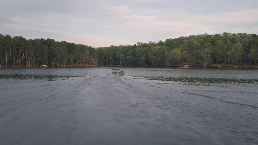 Following pontoon boat across Lake Murray in South Carolina