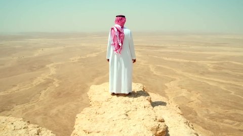 Arabian Desert / Saudi Arabia 07.09.2017         footage of men looking on Arabian Desert 