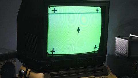 Zooming out of green screen on an old vintage style computer monitor from 70s 80s