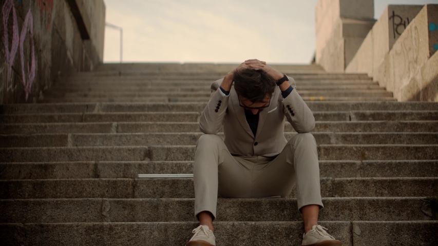 Tired Businessman In City Street.Overwhelmed Exhausted Stressed Man. Frustrated Businessman Sitting On Steps.Remote Work Overtime.Workaholic Work In Internet Deadline.Tired Worker Overworked On Laptop | Shutterstock HD Video #1052089111