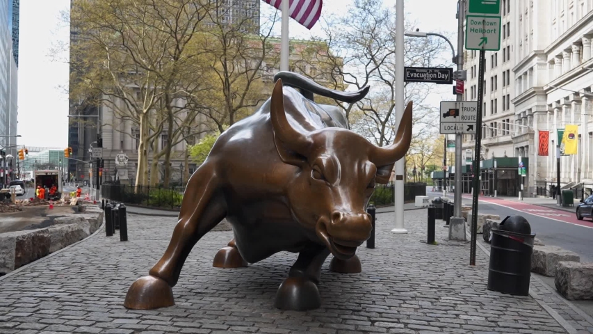 Charging Bull, the Wall Street Bull in empty NY during Pandemic COVID19 (Corona Virus Deases 2019), quarantine, Self isolation and social distancing. Empty town, Manhattan, New York, US 04.25.2019
