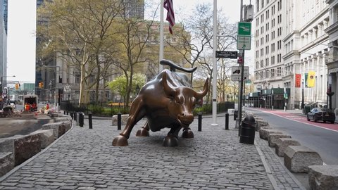 Charging Bull, the Wall Street Bull in empty NY during Pandemic COVID19 (Corona Virus Deases 2019), quarantine, Self isolation and social distancing. Empty town, Manhattan, New York, US 04.25.2019
