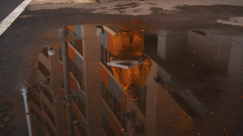 Drops pizza boxes in the puddle and step on it