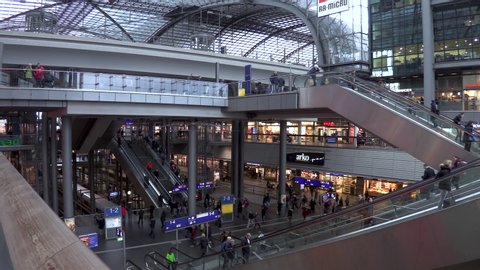 TIMELAPSE HAUPTBAHNHOF RAILWAY STATION INTERIOR, BERLIN, GERMANY, 20 FEBRUARY 2020: Time lapse video of people passengers on escalators inside Hauptbahnhof train Station, Berlin, Germany