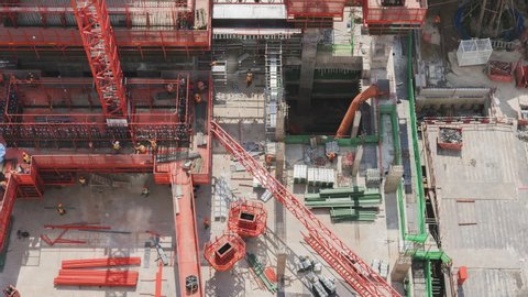 4k timelapse of Aerial view of working Construction site Large construction site including several cranes working on a building area pan view
