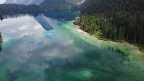 drone records beautiful crystal clear mountain lake dolomites italy, tovel lake gorgeous water