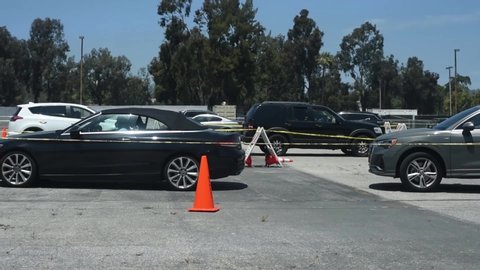 Los Angeles, California / United States - May 8, 2020: Queue at a drive thru COVID-19 testing site. Veterans Affairs in West Los Angeles