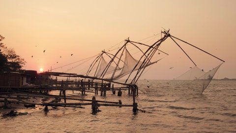 Chinese fishing net at sunrise in Cochin, Kerala, India. Famous landmark in Fort Kochi