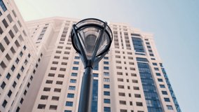 Modern street lamp on the background of a multi-storey building - Powered by Shutterstock - Get 15% off with code: PIKWIZARD15