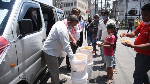 Guwahati, Assam, India. 4 May 2020. Volunteer distributes food to needy people during nationwide lockdown in Guwahati. 