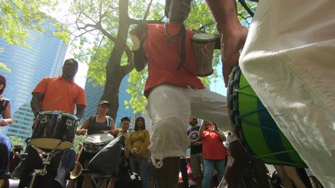 Montreal , Quebec / Canada - 07 01 2019: Dancing, dancer, Percussion performers, musicians, band playing percussion, drum instruments, rhythm art, outside festival, tabla, beat drummers, tambourine, d