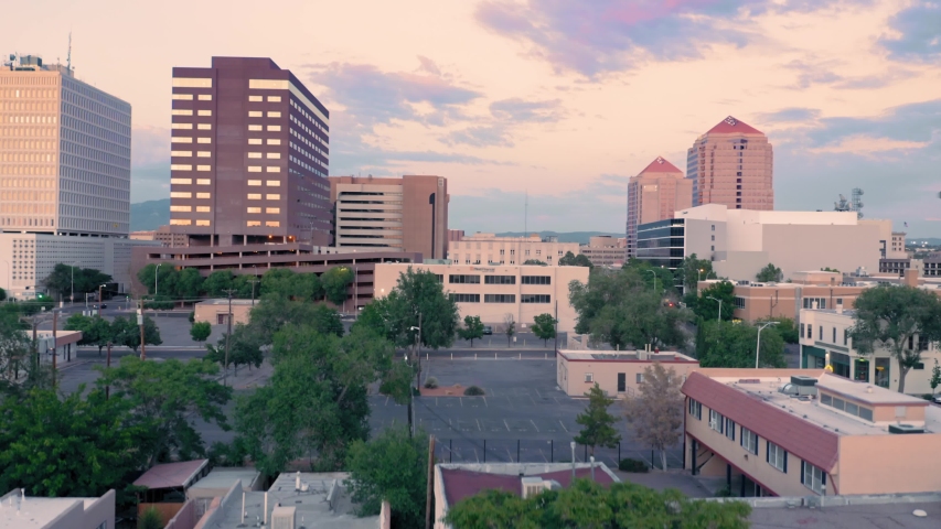 Albuquerque, New Mexico, USA. Aerial flying over the downtown city CBD at sunset 