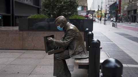Statue in mask in NY during Pandemic COVID19 (Corona Virus Deases 2019), quarantine, Self isolation and social distancing. Empty town, Manhattan, New York, US 04.25.2019