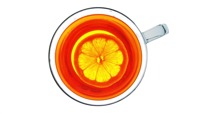 Tea with lemon. View from above. Creative background video.
Black tea with lemon. Creative video of lemon spinning in a cup of tea. View from above. Perfect background stock video footage for the web | Shutterstock HD Video #1052166847