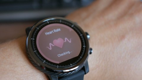 Checking the heart rate by smart watch. Smartwatch. Touching screen. Pulse checking. heart rate monitor