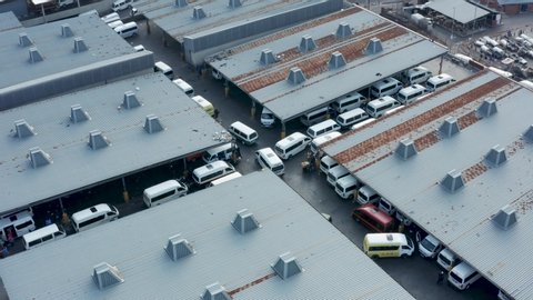 Aerial shot of the Bree Street taxi rank in Johannesburg, South africa showing the many parked minibus taxis. 