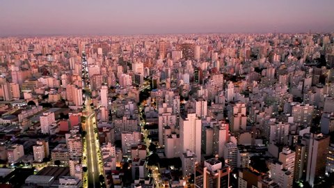 São Paulo, São Paulo, Brazil - 05/09/2020 - Panoramic aerial view of sunset in the city life scene with sun rays reflecting in skyscrapers. Great landscape.