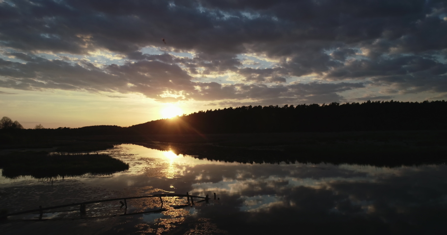 Beautiful sunset on the lake in Ukraine Moving backwards.