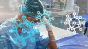 Animation of Covid-19 cells icons and country names floating over a doctor sitting, hiding his face in his hands. Global pandemic coronavirus Covid 19 outbreak concept digitally generated. - Powered by Shutterstock - Get 15% off with code: PIKWIZARD15