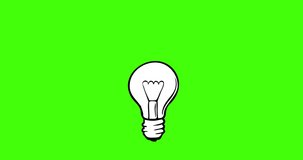 The light turns on, lights up, abstraction - an idea comes to a person. Burning light bulb on a green background.
