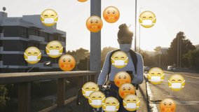 Animation of emojis floating over a woman walking on a street with a bike, using a smartphone. Global pandemic coronavirus Covid 19 outbreak concept digitally generated. - Powered by Shutterstock - Get 15% off with code: PIKWIZARD15