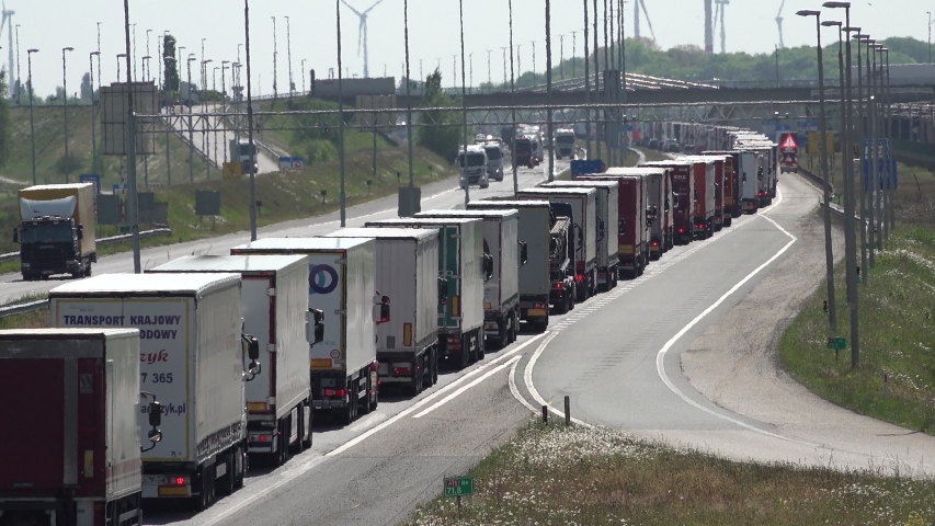HAZELDONK, NETHERLANDS – 6 MAY 2020: Europe infrastructure and transportation issues due to coronavirus Covid-19 outbreak, huge traffic jam of cargo trucks at Dutch Belgian border crossing 