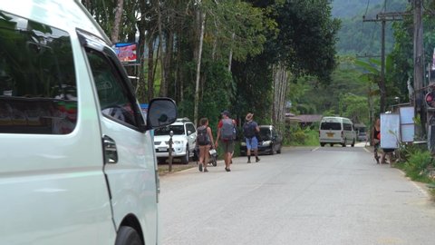 Khao sok / Thailand - 12 15 2019: The white van is passing by from the tourists in Thailand