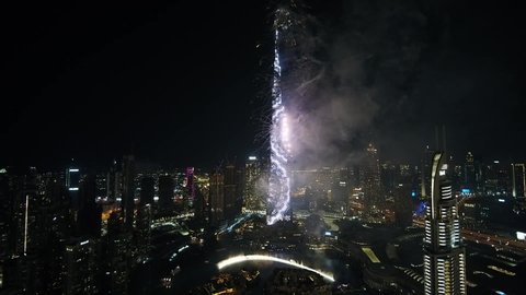 Dubai, United Arab Emirates - 12/31/2019 : Brilliant firework show displayed by the Burj Khalifa on the night of New Year, drone shot 