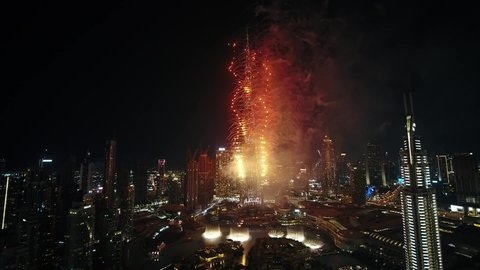 Dubai, United Arab Emirates - 12/31/2019 : The Burj Khalifa displaying wonderful firework show on New Year's Eve, drone shot. 