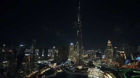 Dubai, United Arab Emirates - 12/31/2019 : Roll with sliding shot of Burj Khalifa in the night looking mesmerizing, drone shot.