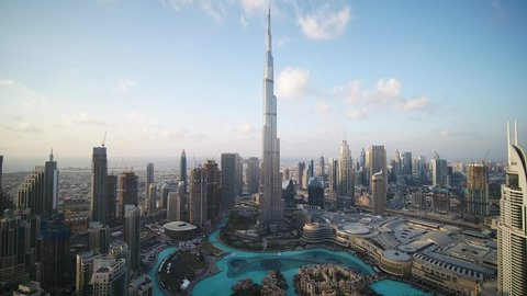 Dubai, United Arab Emirates - 12/31/2019 : Pull back shot of the magnificent Architecture of Dubai, Burj Khalifa, drone wide shot.