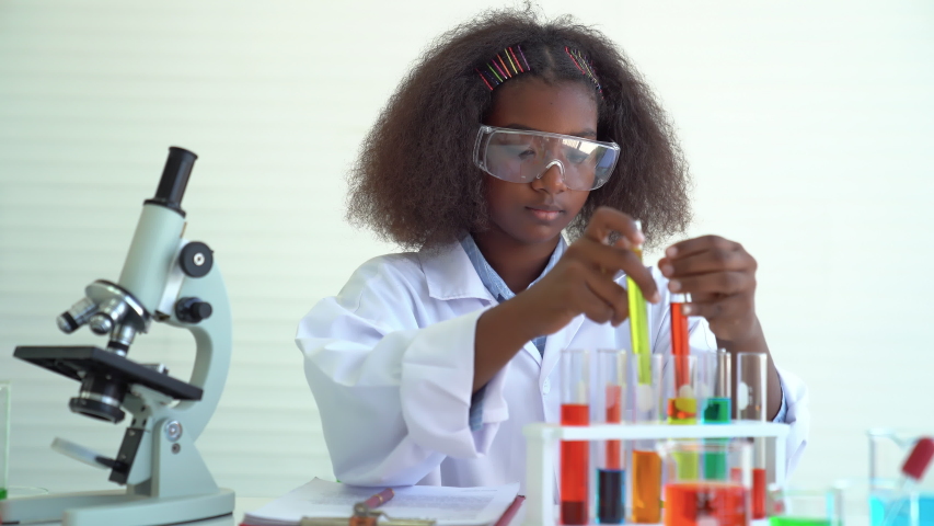 Black girl kid thinking Formula science idea and inspiration innovation technology of world in education. Royalty-Free Stock Footage #1052220190