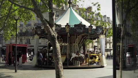Paris, France - 05 11 2020: Parisian 
 traditional kids carousel re-opening on first day after coronavirus / Covid-19 quarantine 4K
