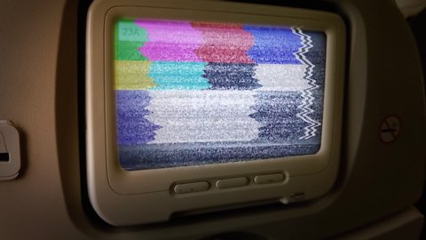 Monitor with Green Screen on Passenger Seat of an Airplane. You can replace green screen with the footage or picture you want. You can do it with “Keying” effect in After Effects. Zoom In.
