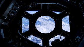 View of Planet Earth through the porthole of the International Space Station. Zoom In. Elements of this Video Furnished by NASA. 
