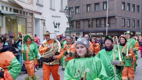 Düsseldorf , NRW / Germany - 02 22 2020: Rosenmontag Carnaval in Düsseldorf, Germany With Green Custom in Slow Motion