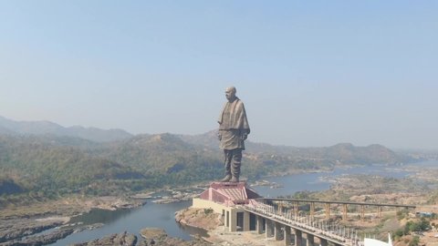 Statue of unity, Gujarat,India. November 10,2018. Aerial view of tallest statue of world .panning drone shoot with Narmada river and people around. Zoom in.