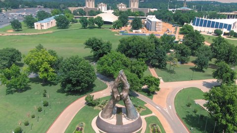 Tulsa, Oklahoma, USA. 1 May 2020. Aerial of sculpture of hands praying at Oral Roberts University a Christian education university. 