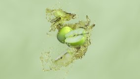 Green apple slices with juice splash. Super slow motion shot. - Powered by Shutterstock - Get 15% off with code: PIKWIZARD15