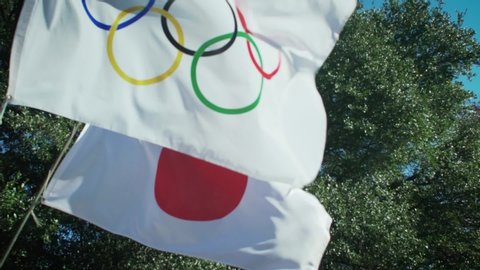 Tokyo / Japan - 06 01 2019: 2020 Summer Olympics rings logo with national Japan country flag