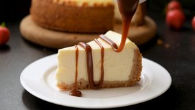 Cheesecake with caramel sauce. Caramel sauce pouring on slice of new york cheesecake - Powered by Shutterstock - Get 15% off with code: PIKWIZARD15
