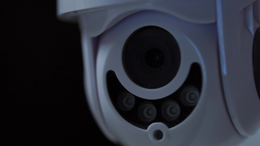 Cinematic Cctv Security Camera Rotates At Night, 4K Surveillance. Royalty-Free Stock Footage #1052302219