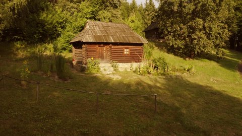 Ancient rustic cabin in a forest. House made of wooden logs.