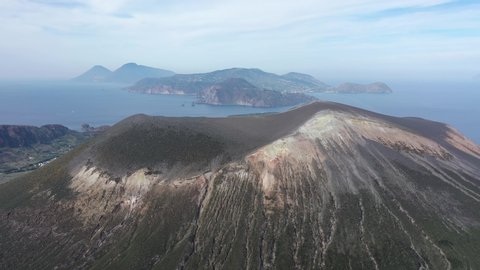 Aerial view 4K video from flying drone of Panoramic view from mountain roadsthe volcano of Vulcano Island in a summer day. The islands of Lipari and Salina Aeolian Islands, Sicily, Italy. (series)